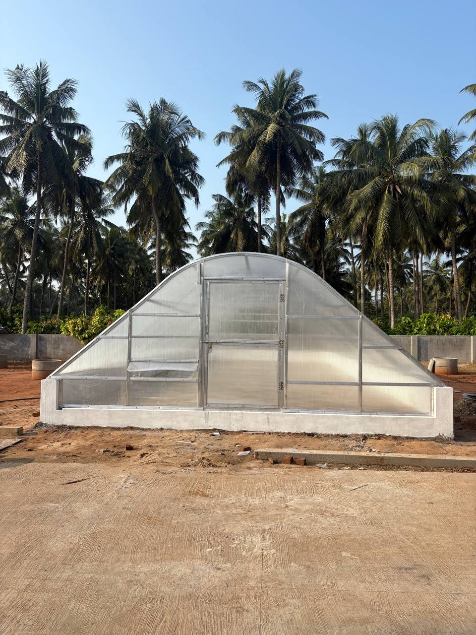 Solar tunnel dryer exterior view — Verdant Farms installation